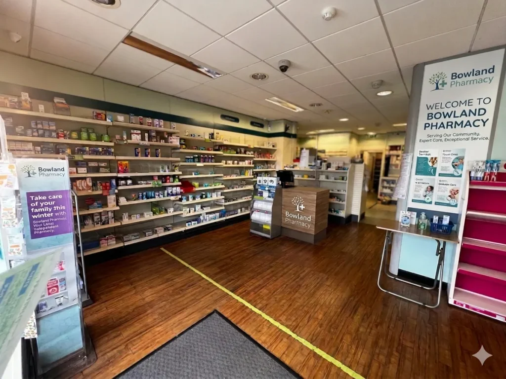 Inside Bowland Pharmacy, with the welcome sign and shelves of health products